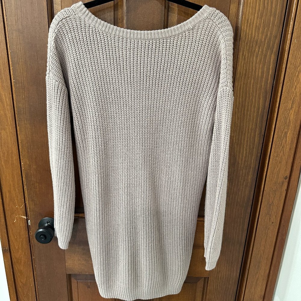 Blush colored long sleeve sweater dress with v-neck back.